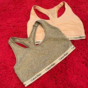 Two Calvin Klein bras.